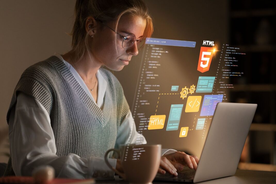 Woman working on laptop with web development